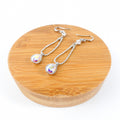 boucle d'oreille goutte reflet