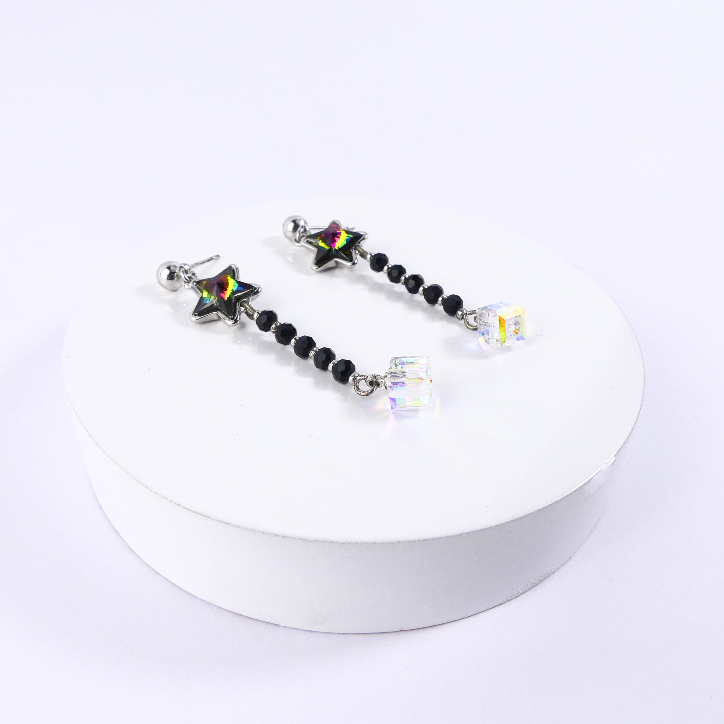 boucle d'oreille pendantes étoile verte reflet